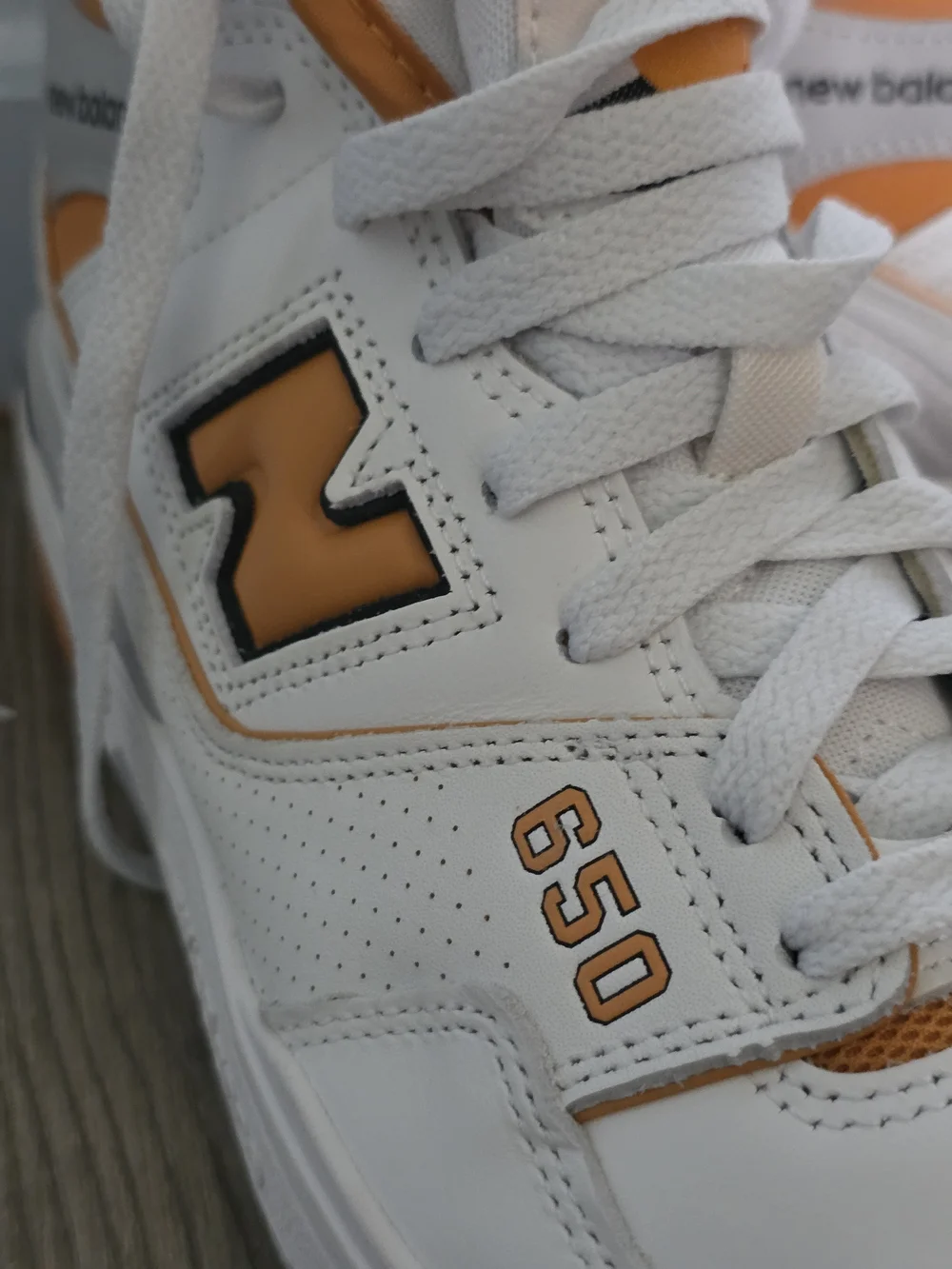 New Balance White and Orange Mid-Top Athletic Sneakers